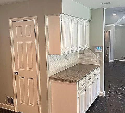 Kitchen looking into living room
