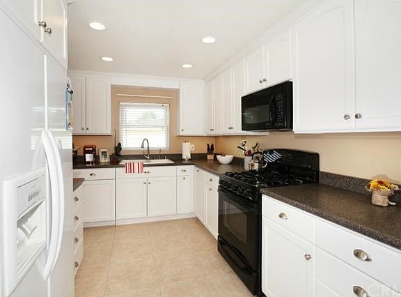 Updated Kitchen has an Great Storage with a Cabinet Faced Bosch Dishwasher & Integrated Trash Area.
