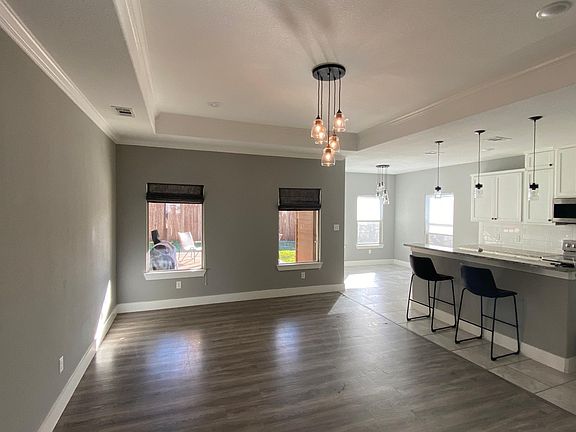 Open plan living area and kitchen. Beautiful vaulted ceilings.