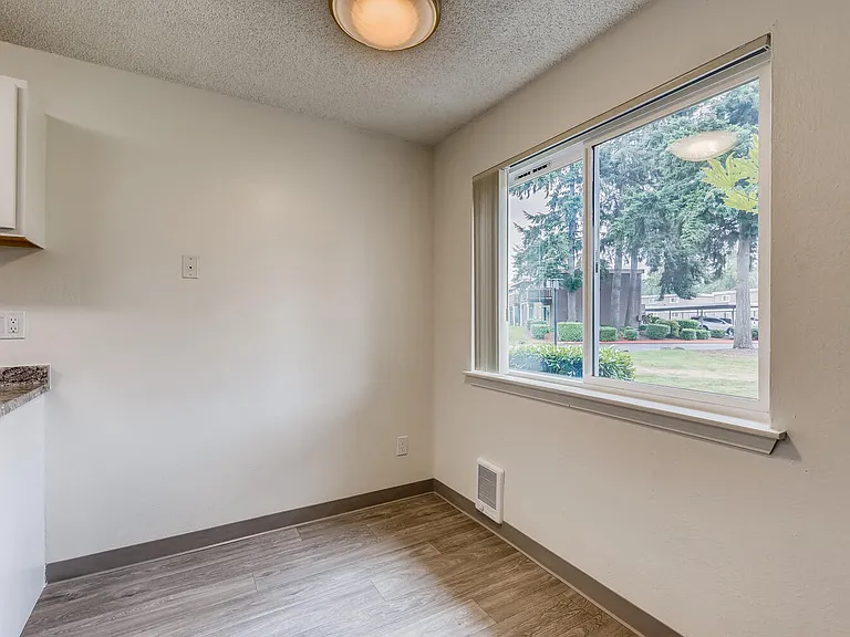 A Standard Kitchen and Window at Morningtree Park Apartments