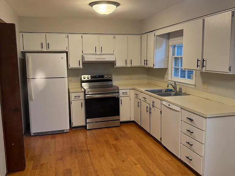 Kitchen with updated stove range.