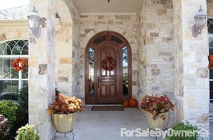 Front door
						:
						Beautiful custom arched wood front door