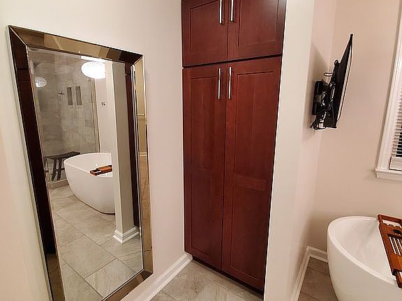 Master bath linen storage.