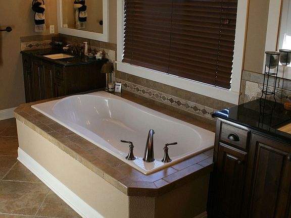 Hand chiseled travertine throughout Master Bath