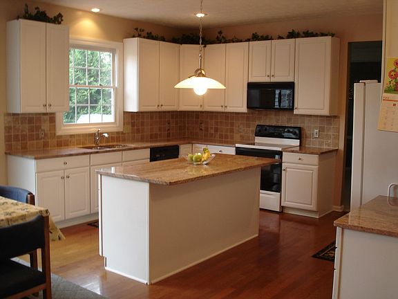 Kitchen with granite countertops.  All appliances stay.
