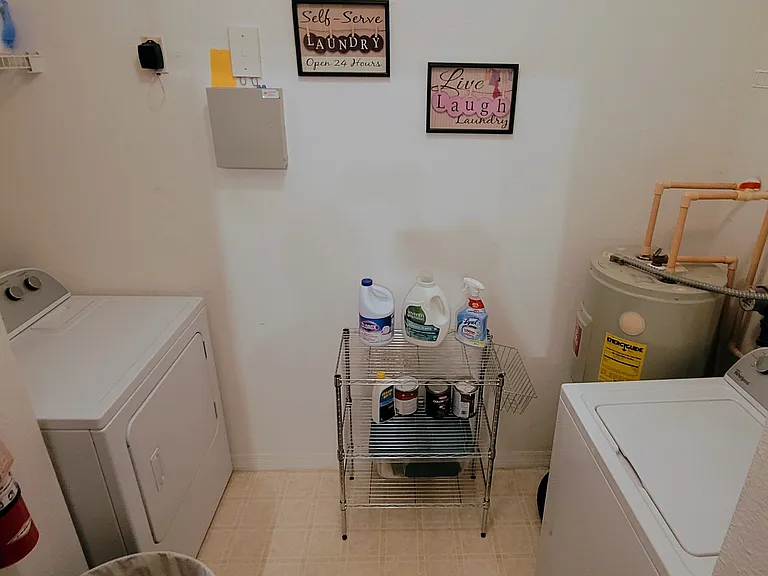 Full walk in laundry room w/ washer & dryer