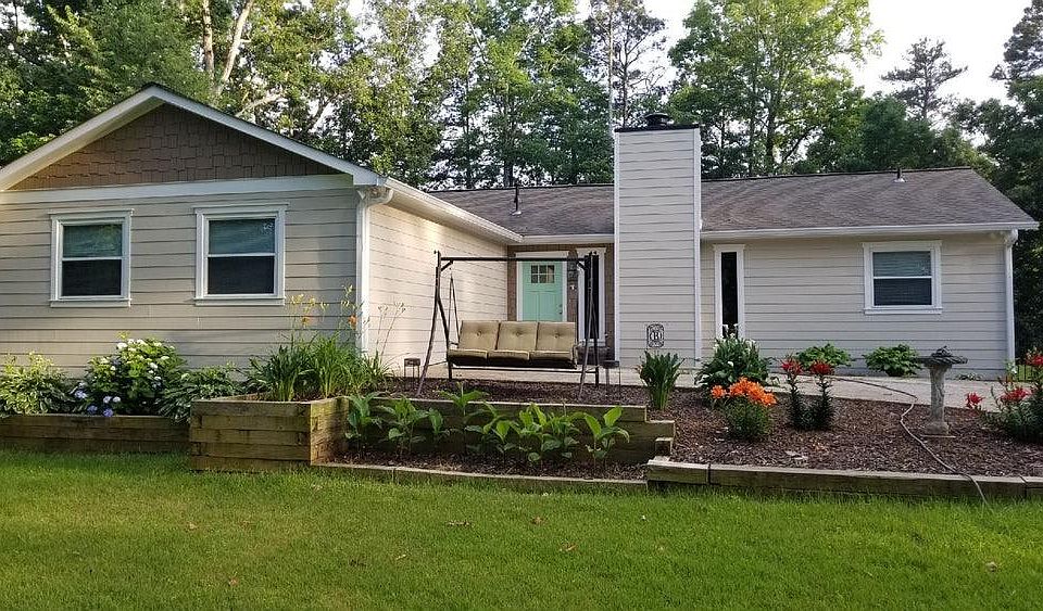 Front of house in Spring. New siding and paint!