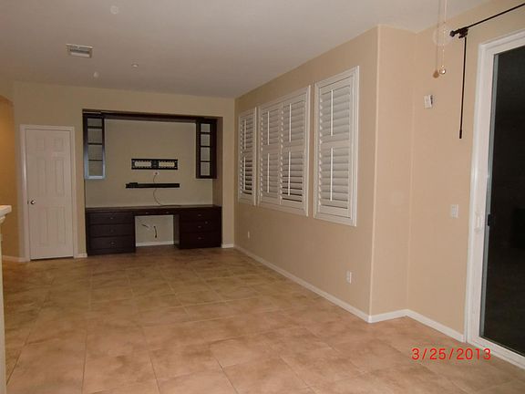 Plantation shutters, built-in entertainment center/desk