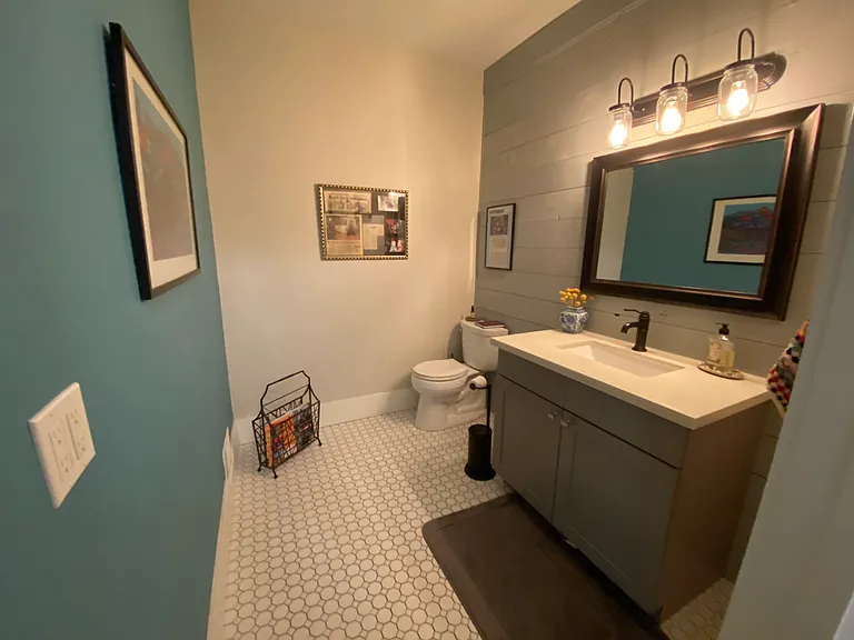 Main floor powder room off the office