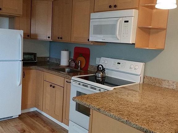 Granite counters and full size appliances in kitchen