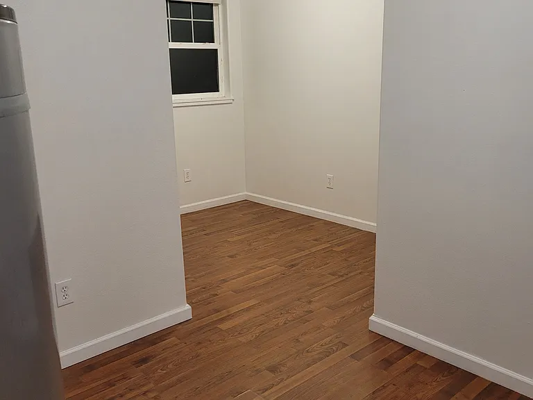 laundry room from where the washer/dryer would set. Water heater tank on left.