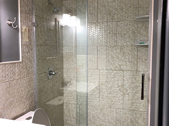Ample tiled shower 