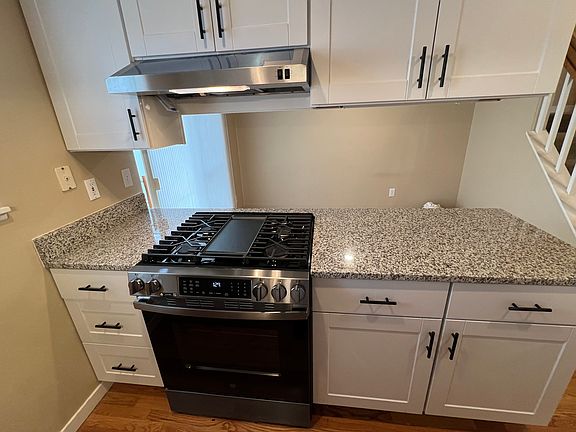 New gas range in kitchen.