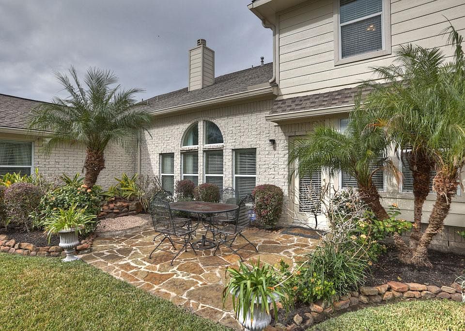 An extended flagstone Patio and waterfall are attractive and useful additions to this home. The pleasing outdoor space can be viewed from many of the home's rooms. Just the place to entertain guests and family.
