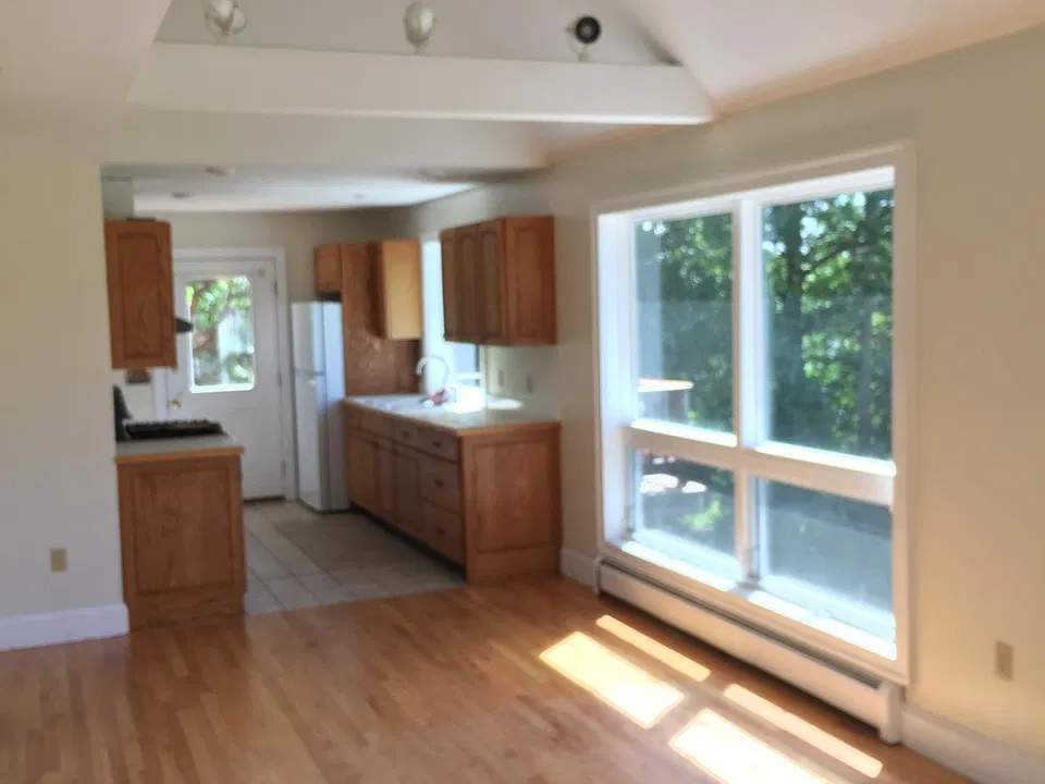 View from living area through dining area on into the kitchen.