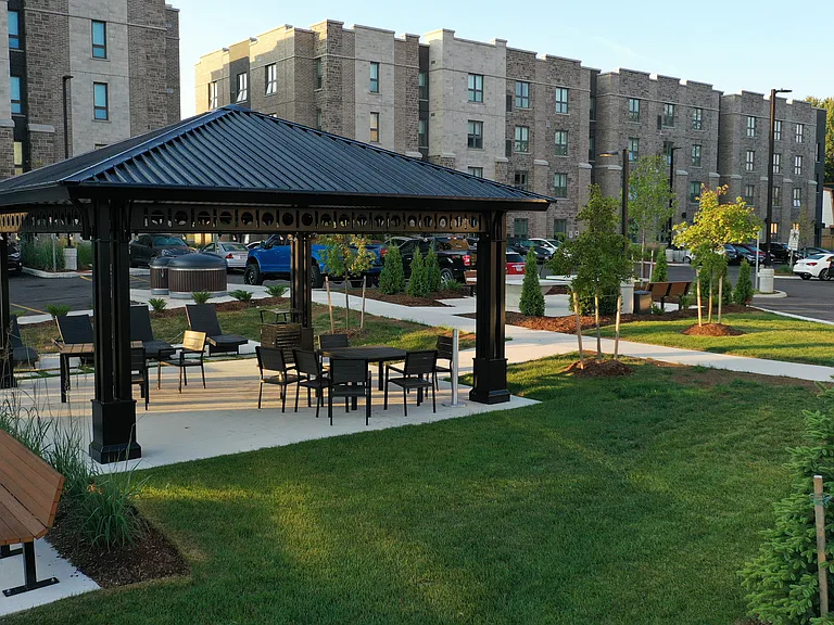 Outdoor space with seating, lounge chairs and ping pong tables