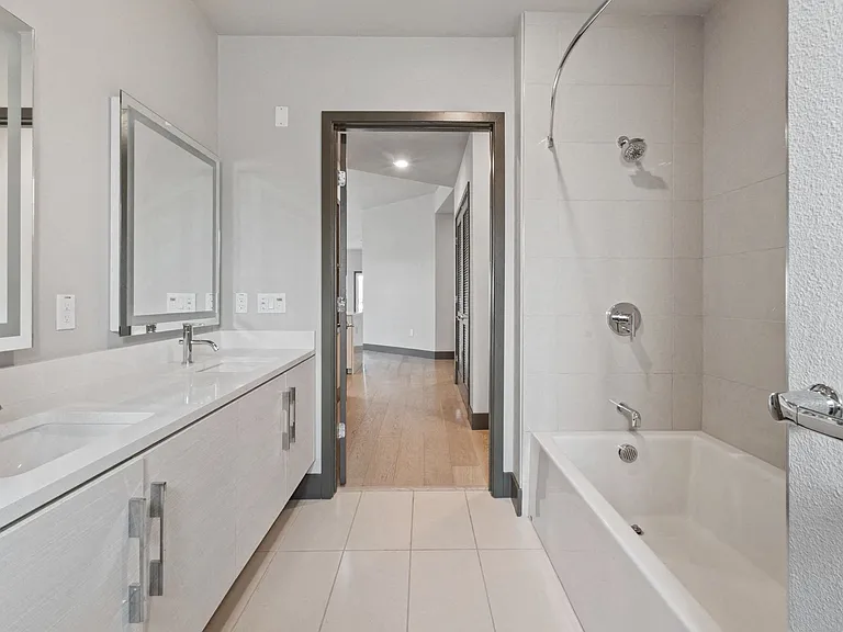 Primary bathroom with dual vanity sinks