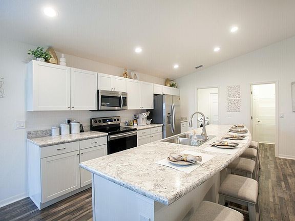 Open kitchen with large counter-height island - New home for sale in Davenport, FL
