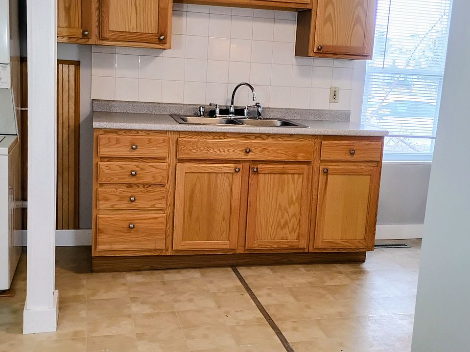 Kitchen Cabinets complimented with beautiful tile, so easy to clean!