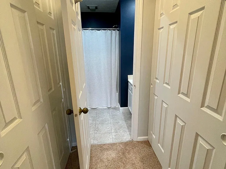 The master bedroom features two closets for ample storage space.