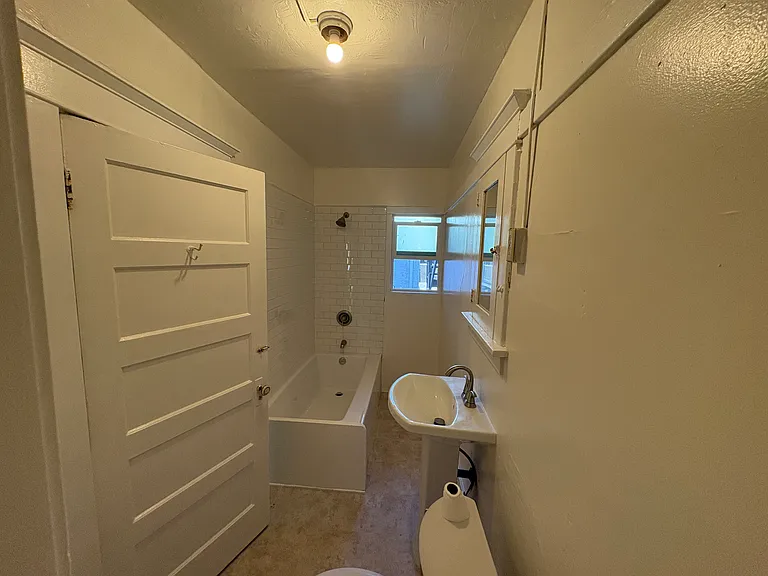 Renovated bathroom - new sink, toilet and bathtub