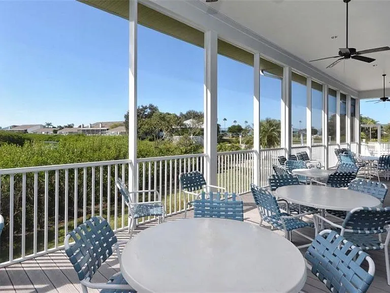 Seating area behind the Clubhouse and next to the almost Olympic size pool.