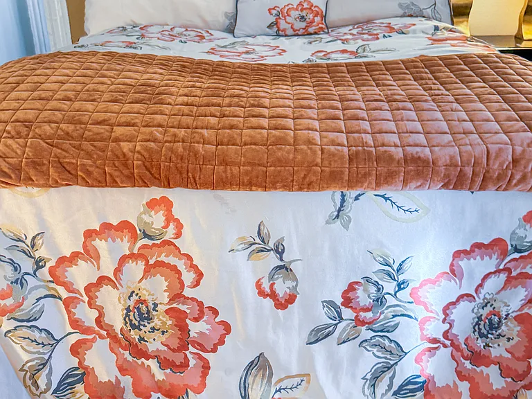 Sturdy mahogany headboard and gracious duvet for Queen bed.