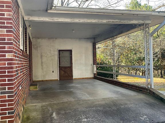 Covered carport (door to storage and laundry)