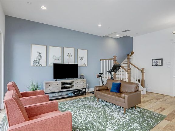 The first floor living/game room has hardwood flooring (18 x 15)