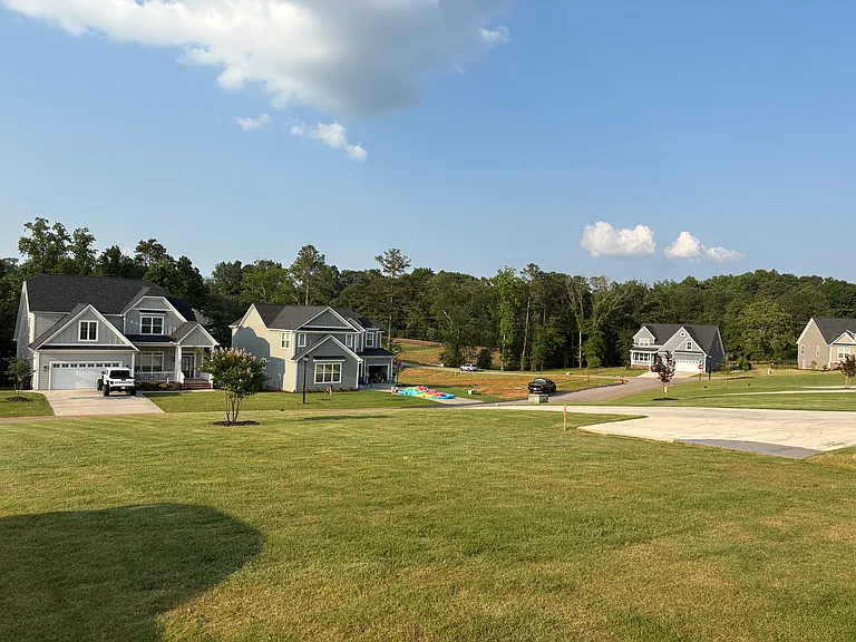 Right view of yard and neighborhood walking out the front door.