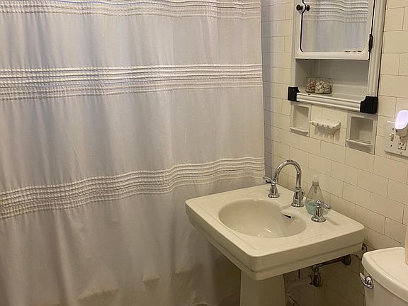Bathroom with door to master bedroom and door to hallway