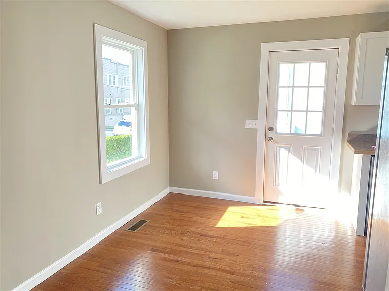 Dining area/kitchen nook, with door to side deck