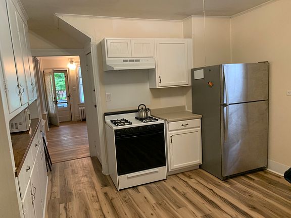 View of Kitchen with Entryway in the Background