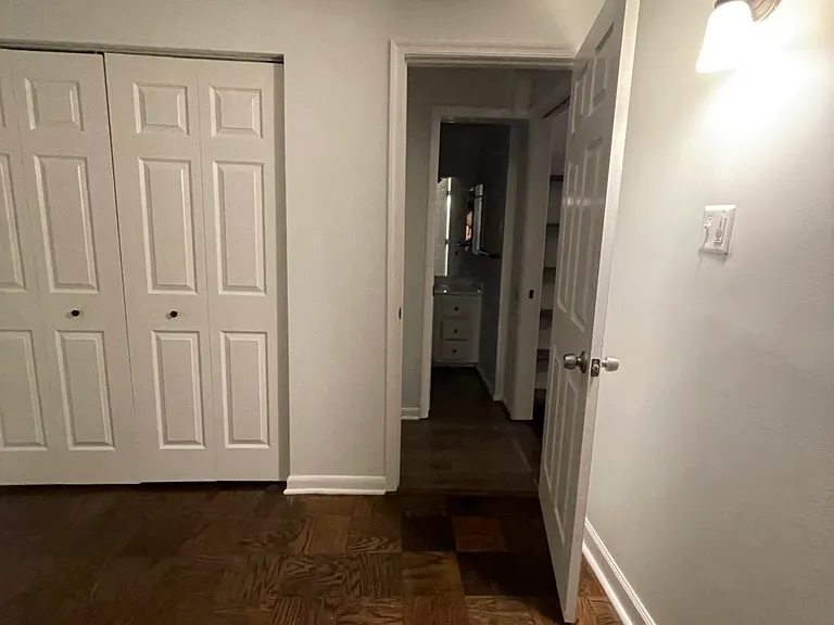 View from inside the main bedroom. Double closet doors visible.