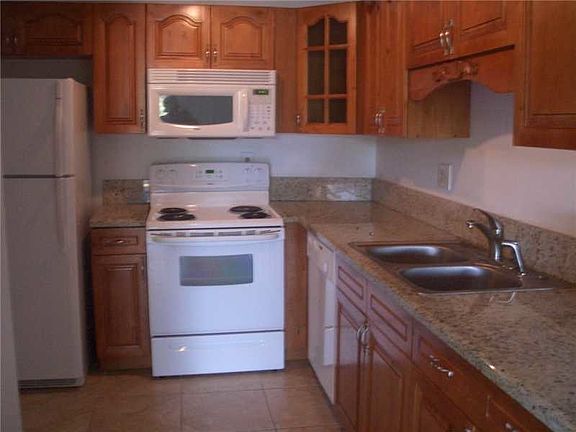 wood cabinets and granite counters