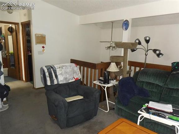 Looking toward the stairs from the living room.  Notice the vaulted ceiling.
