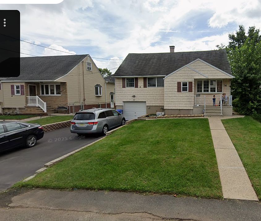 Front of the house with driveway (4 car driveway) and 1 car garage