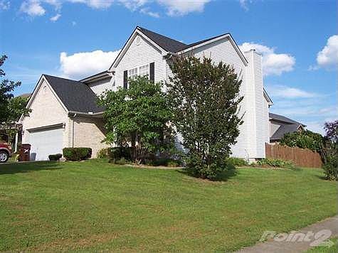 Corner View With Custom Flower Beds and Landscaping