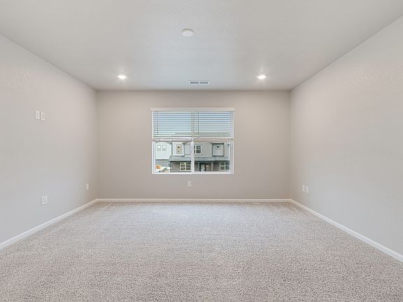 A primary bedroom perfect for unwinding after a long day.