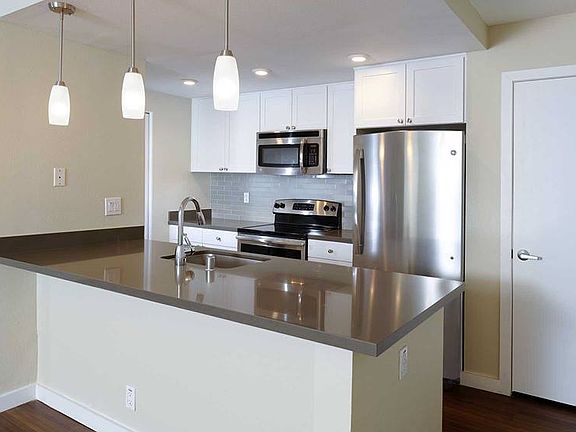 Kitchens With Quartz Countertops Tile Back Splash And Stainless Steel Appliances