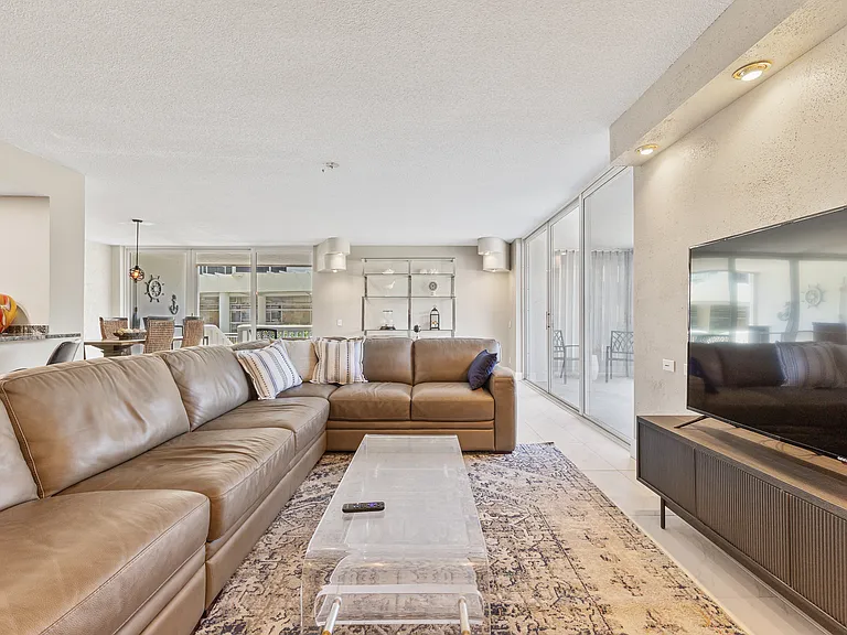 Settle into the living room with a 75" TV and queen pull-out sofa. Sleeps extra guests without sacrificing comfort.