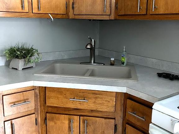 Enjoy conveniences like a new faucet, extra deep solid surface sink, and under cabinet lighting.