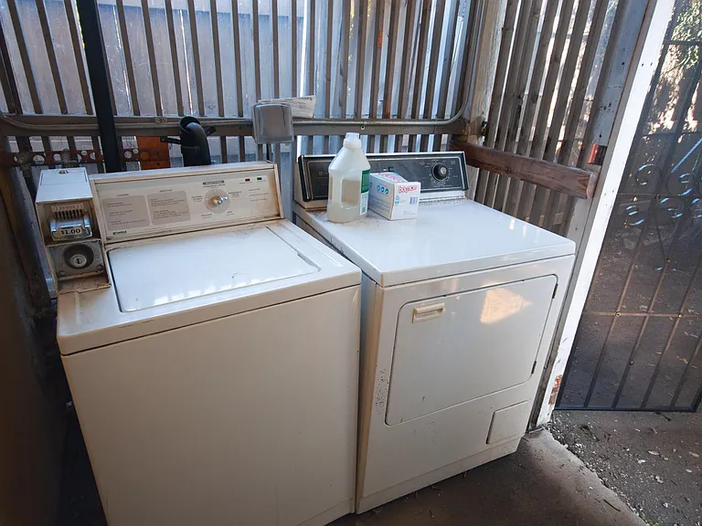 Small external laundry room shared with one other tenant