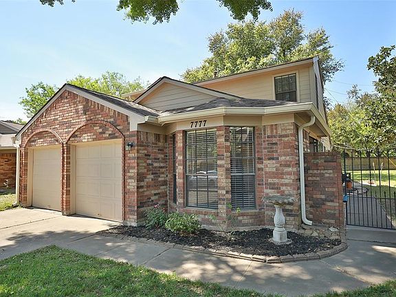 Additional view of your new home, including gated entrance to your front door, and oversized yard.
