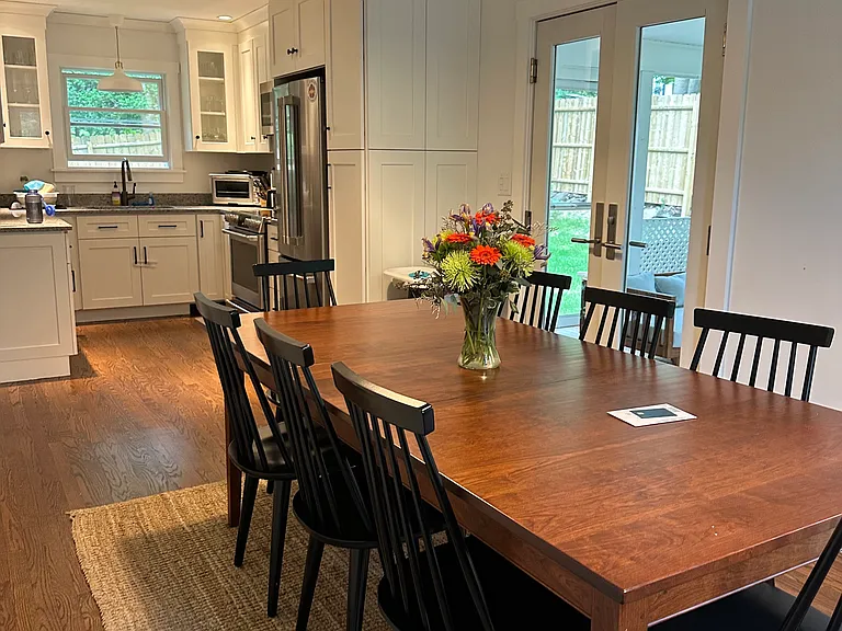 Beautiful bright kitchen, opening with French Doors to sun porch. Eat in dining room with lots of great natural light.