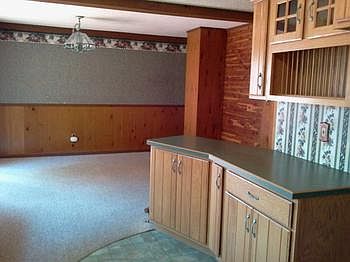 The kitchen has a small snack bar and leads into the open dining roombr