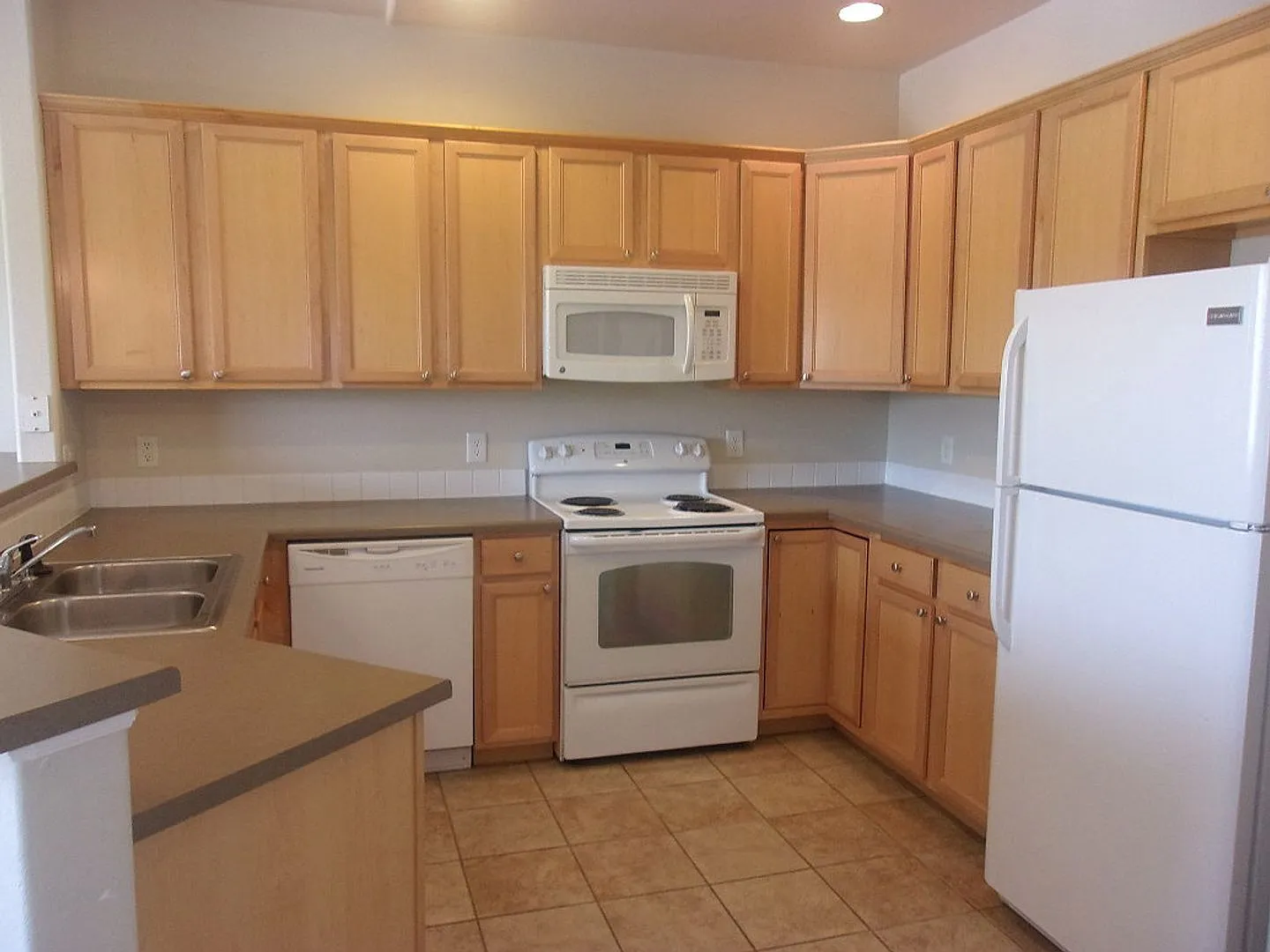 Light-Filled 2 Bed, 2 Bath Condo | Fireplace, Patio & Detached Garage — Photo 3