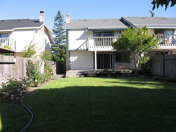 Lush lawn and deck for outdoor fun.