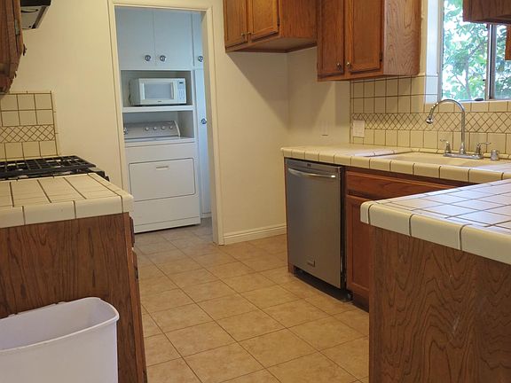 Kitchen with attached laundry room