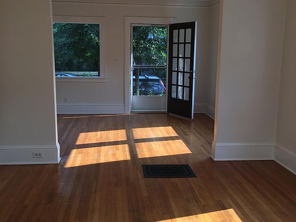 dining room and living room and stairs to basement and large